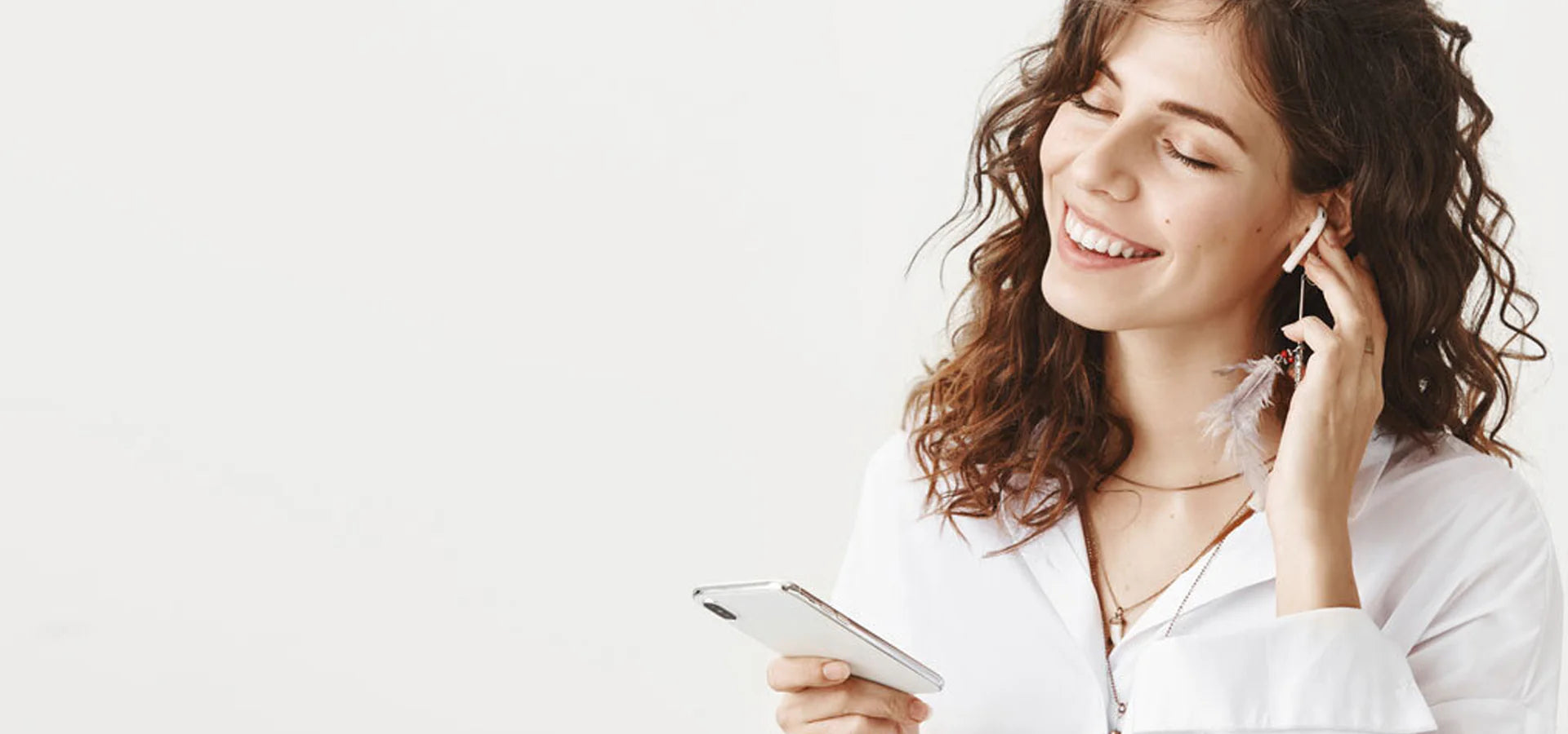 Woman using a smartphone with a white background
